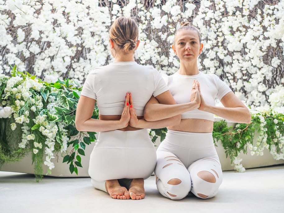 Women in White Activewear Doing Yoga