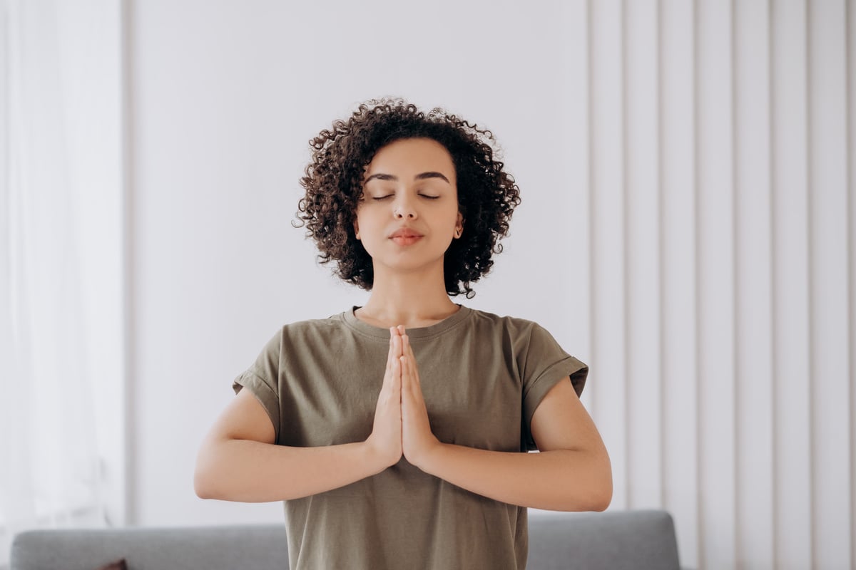 Woman in Gray Crew Neck T-shirt Doing Yoga